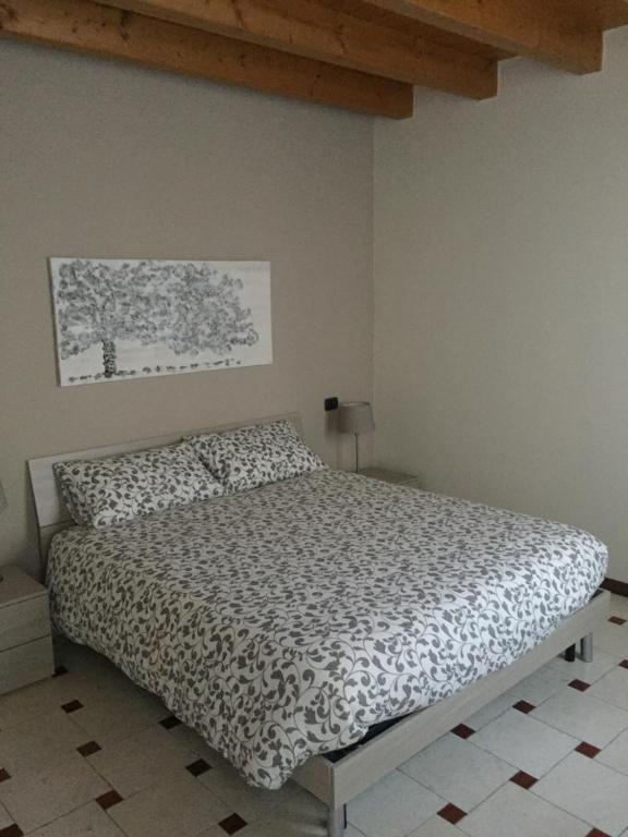 Postel nebo postele na pokoji v ubytování B&B Via Garibaldi