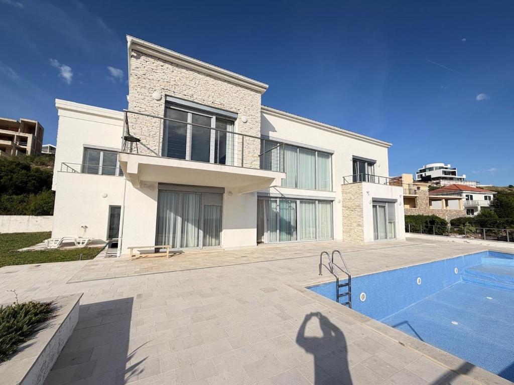 a shadow of a person standing in front of a house at Villa Max in Krimovice