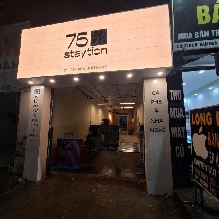 a building with a sign that says station at 75 Staytion in Bien Hoa