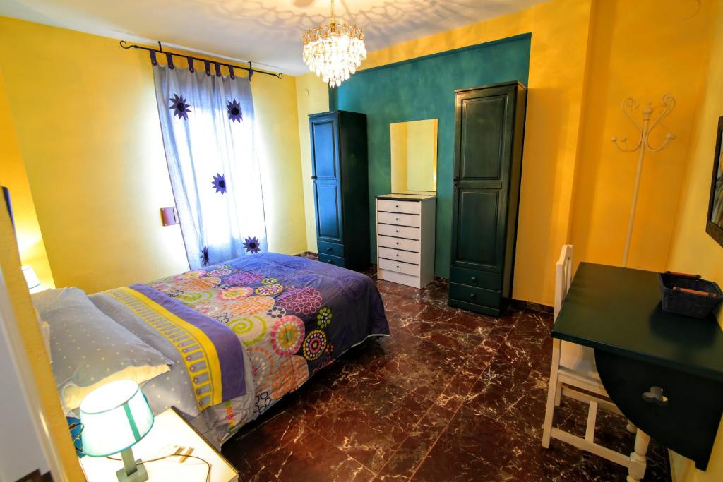 Posteľ alebo postele v izbe v ubytovaní Apartamentos Turísticos La Fonda