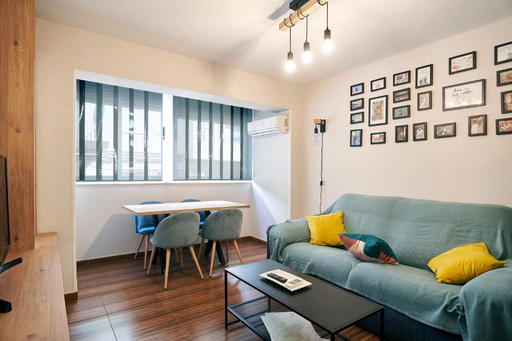 a living room with a couch and a table at The Clock Tower Apartment in Jaén