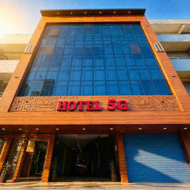 a hotel sign on the front of a building at Hotel 5G in Bhopal