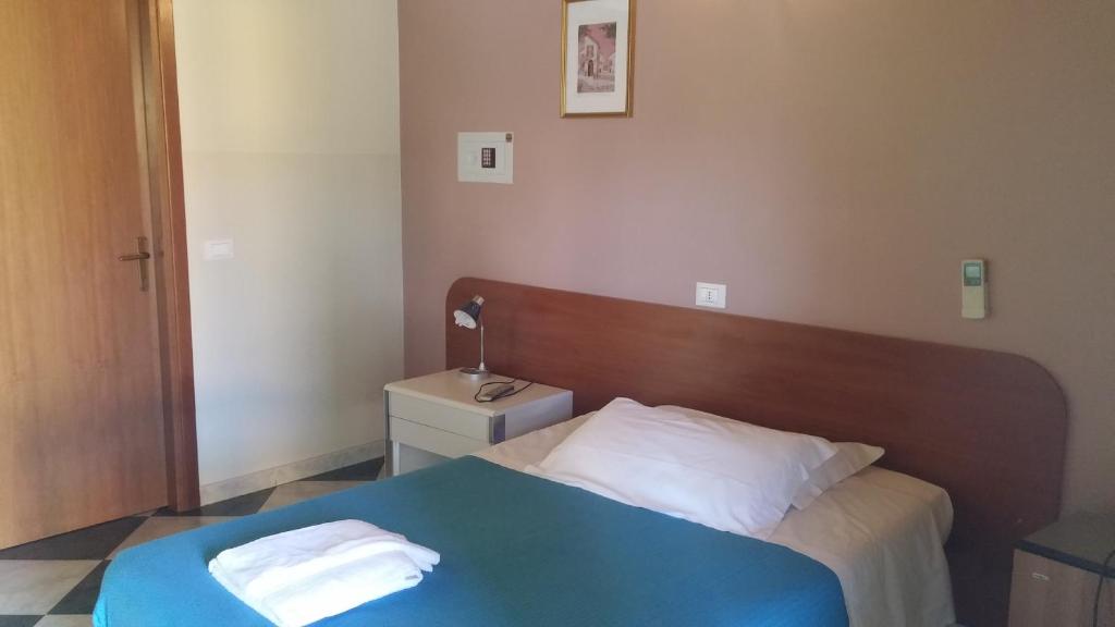Postel nebo postele na pokoji v ubytování Albergo Dell'angelo