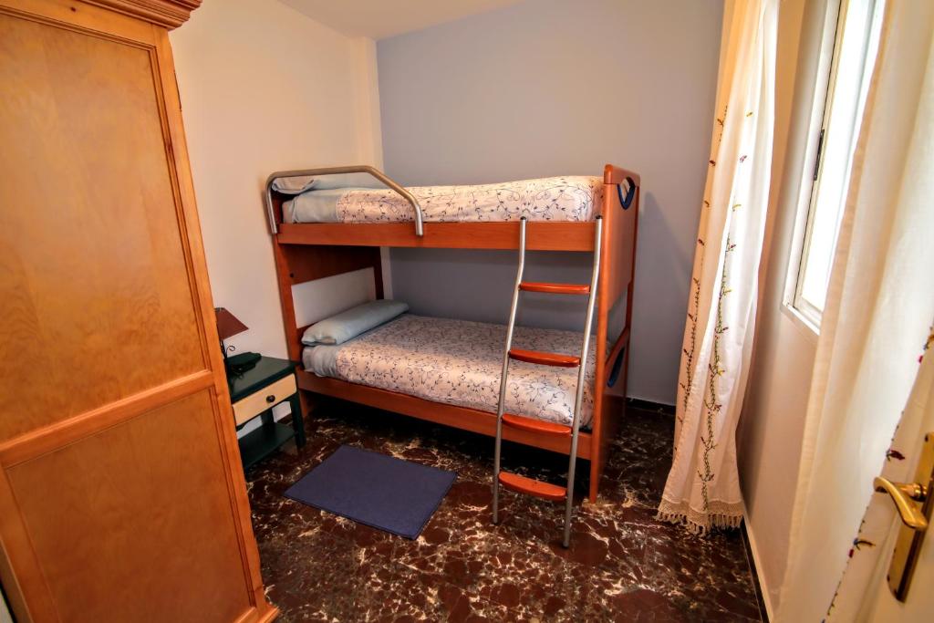 Posteľ alebo postele v izbe v ubytovaní Apartamentos Turísticos La Fonda