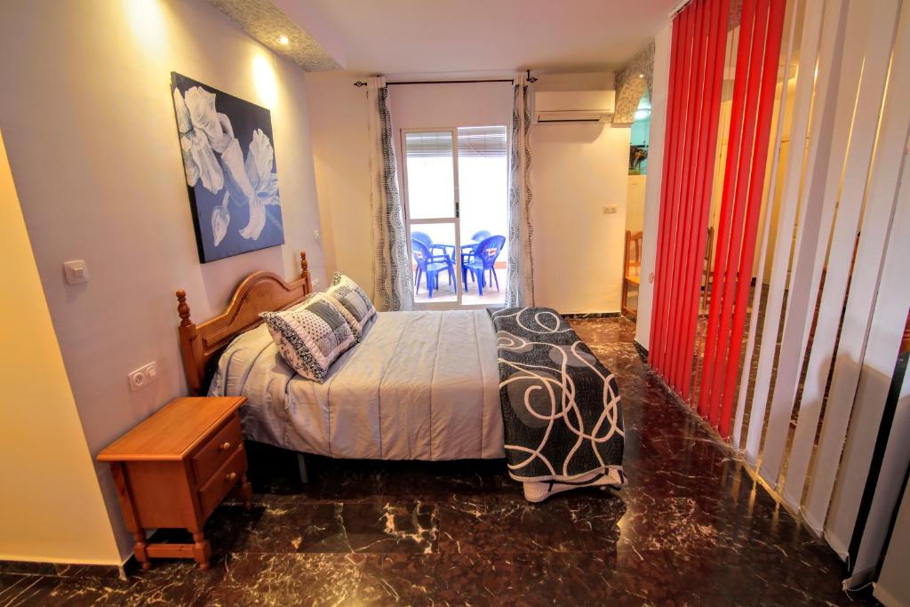 Posteľ alebo postele v izbe v ubytovaní Apartamentos Turísticos La Fonda
