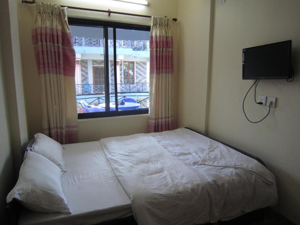 Letto o letti in una camera di Hotel Sunflower