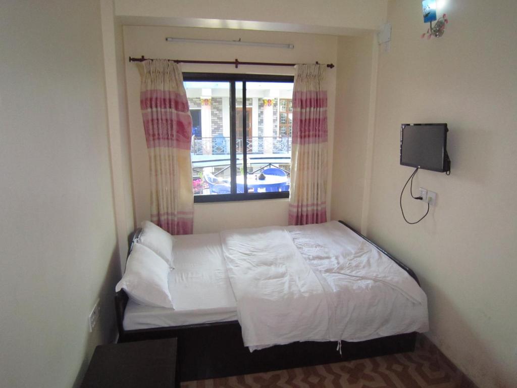 Letto o letti in una camera di Hotel Sunflower