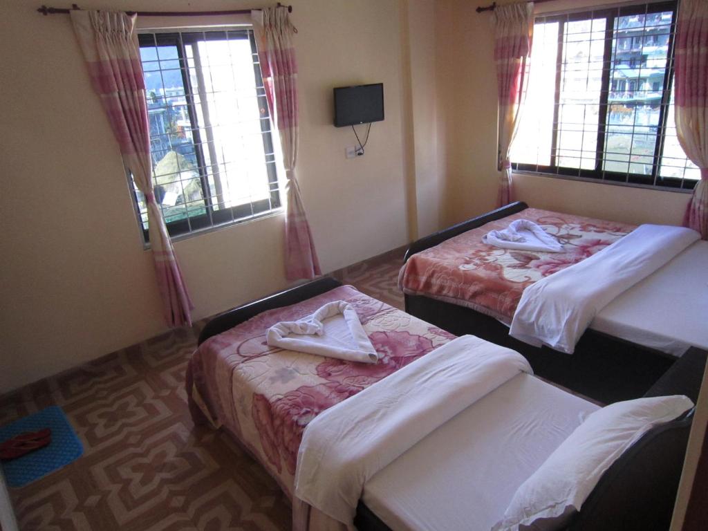 Letto o letti in una camera di Hotel Sunflower