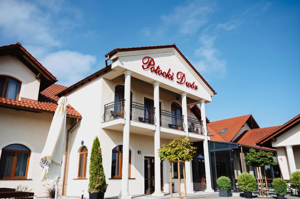 a building with a sign that reads phoenix onion at Potocki Dwór in Jędrzejów
