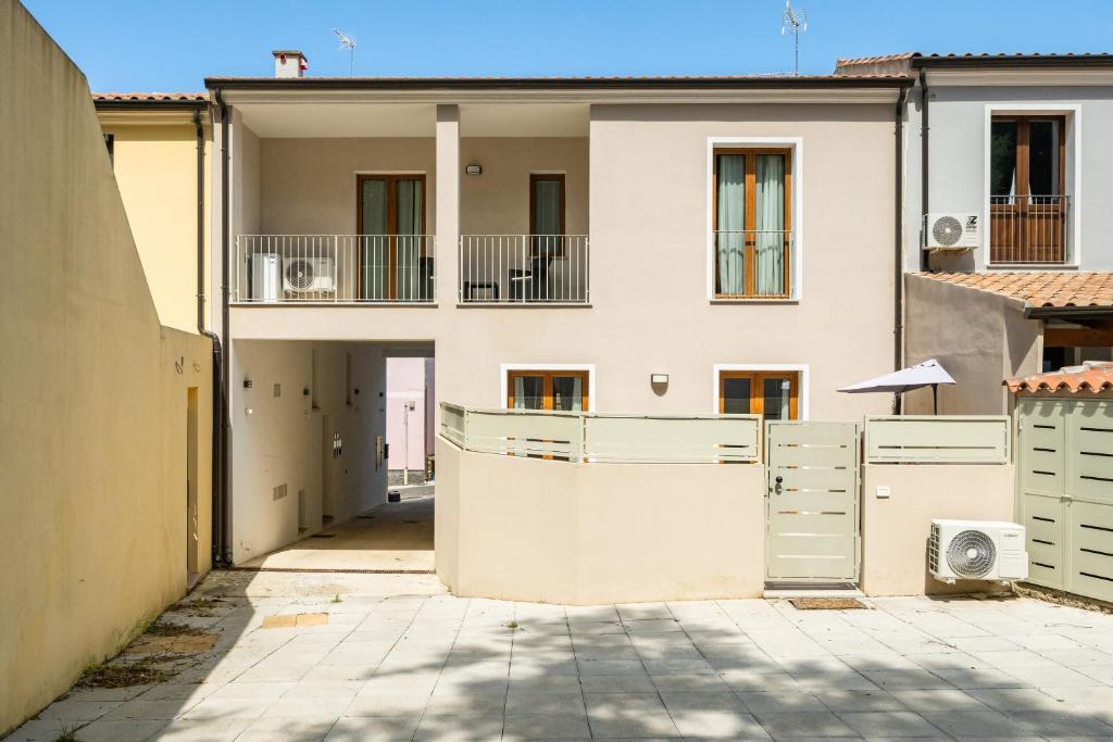 a large white building with a gate in front of it at Sa concia in Teulada