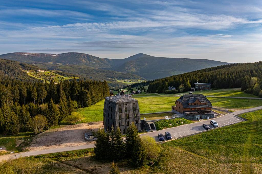an aerial view of a building in the mountains at Apartmán Lidická bouda in Pec pod Sněžkou