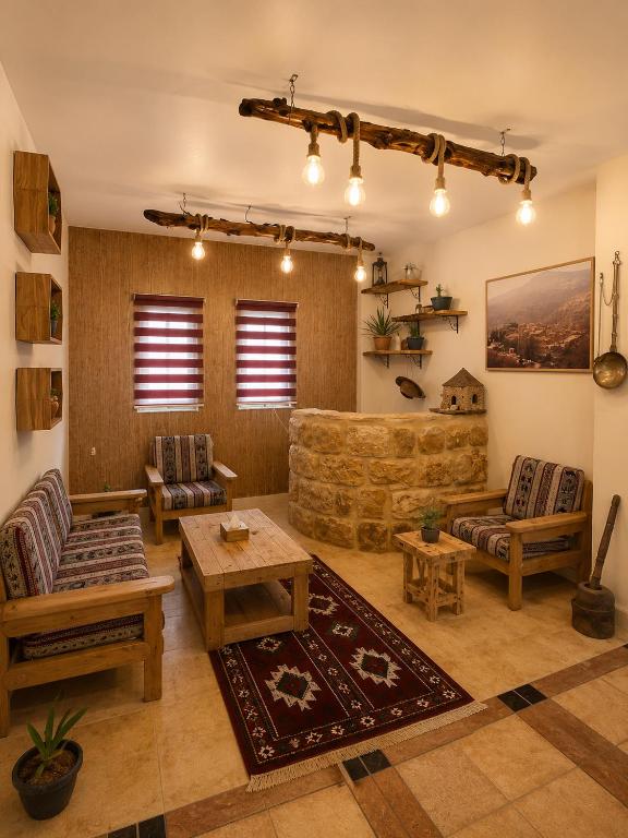a living room with a couch and a table at DANA First View Hotel in Dana
