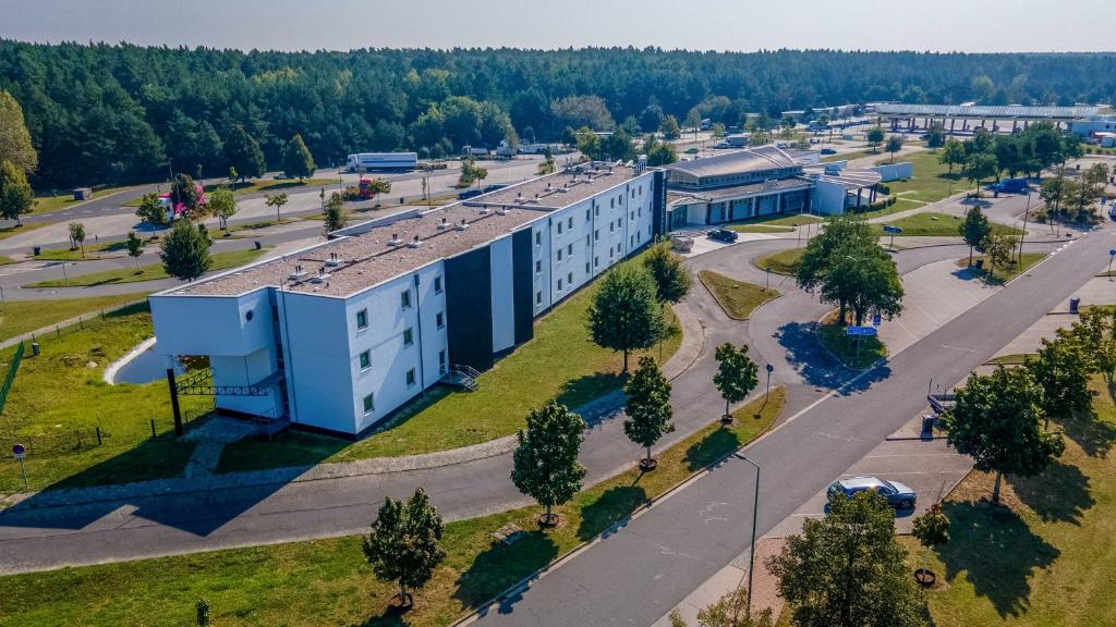 an aerial view of a building in a city at City Best Autobahnhotel Stolper Heide in Berlin