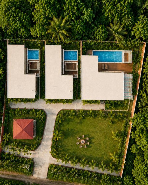 an aerial view of a house with a yard at Dono Pool Villa & Spa in Dauis