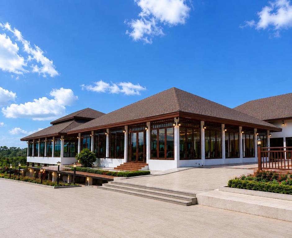 a large building with a brown roof at Ranong Adventure Resort & Park in Ranong