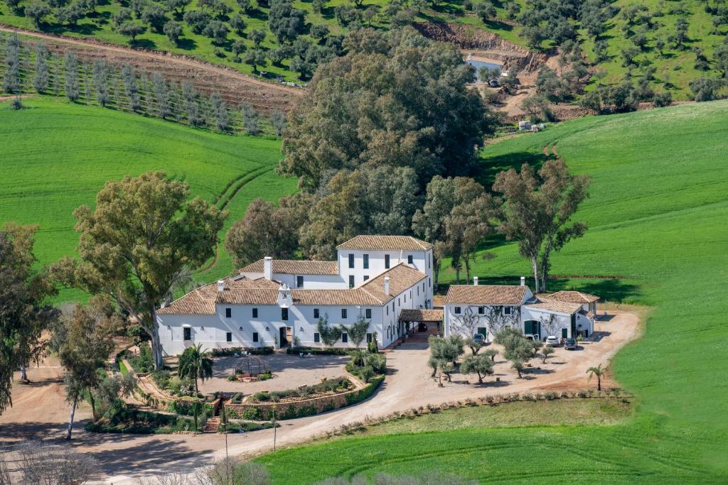 an aerial view of a large white house at Hotel Corbella in Posadas