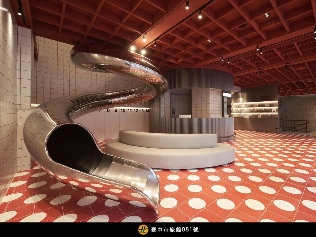 a museum with a spiral staircase in a room at Reddot Hotel in Taichung