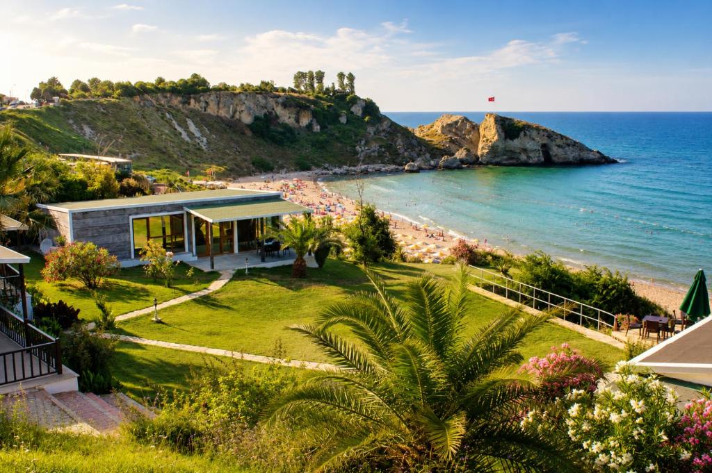 an image of a house with a view of the ocean at Palm Beach Şile Villa Hotels in Şile