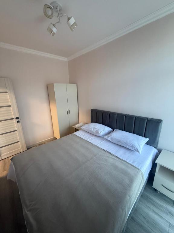 a bedroom with a large bed with two pillows at M&M Hotel in Pʼarakʼar