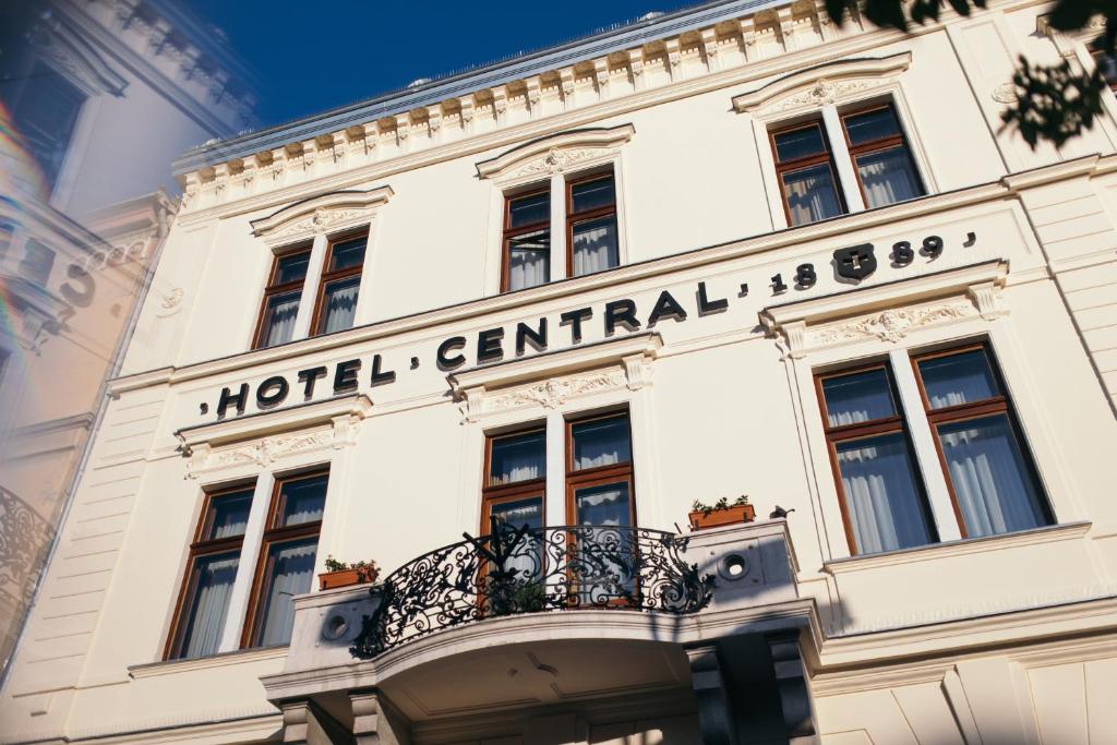 a hotel centennial building with a balcony at Hotel Central in Osijek