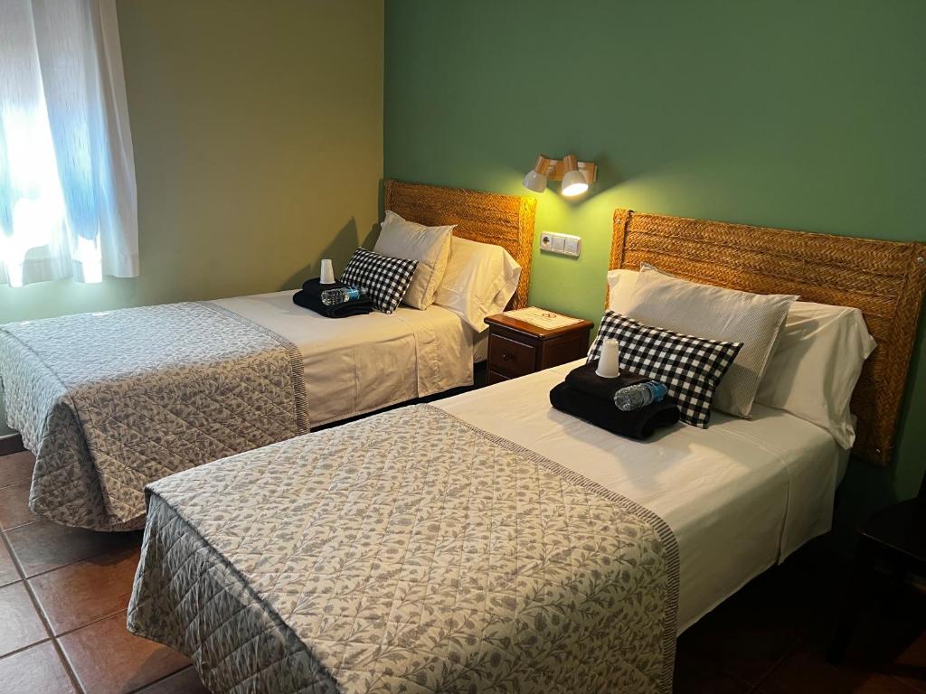 a hotel room with two beds in a room at HOSTAL TREVELEZ in El Ejido