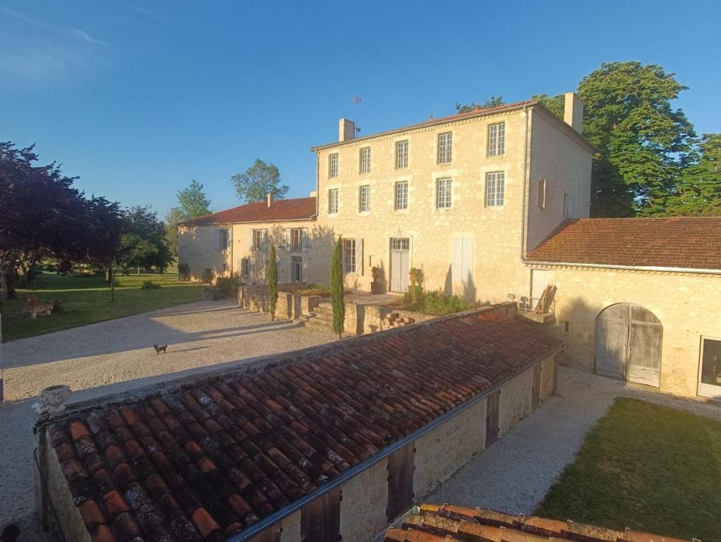 an aerial view of a large building with a yard at Maison Saint-Pé (Gers) in Béraut