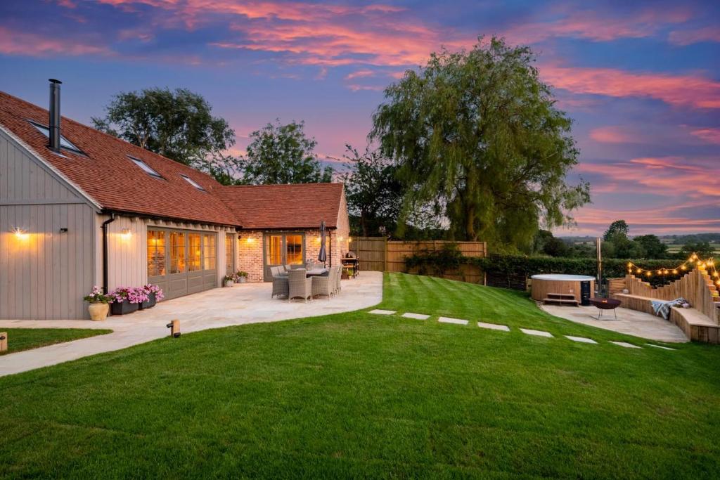 a backyard of a house with a grass yard at 3 Bed in Wittersham oc-m27683 in Wittersham