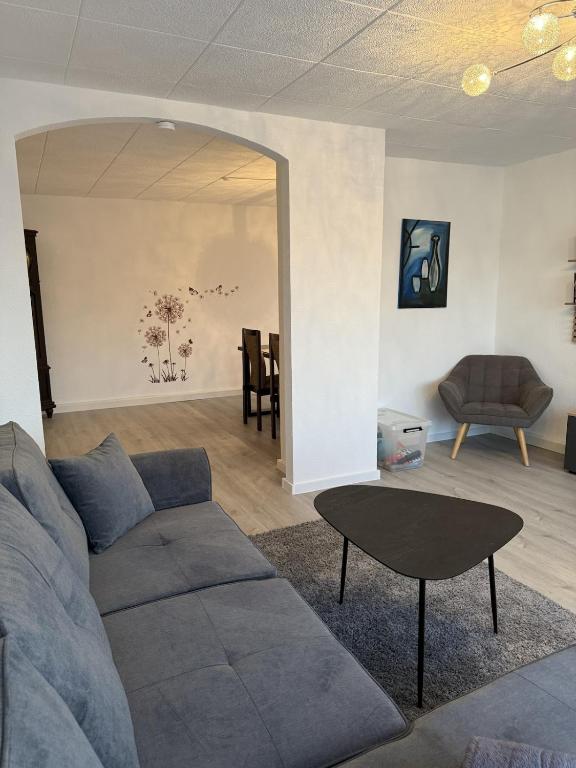 a living room with a couch and a table at Manni's Home in Munderkingen