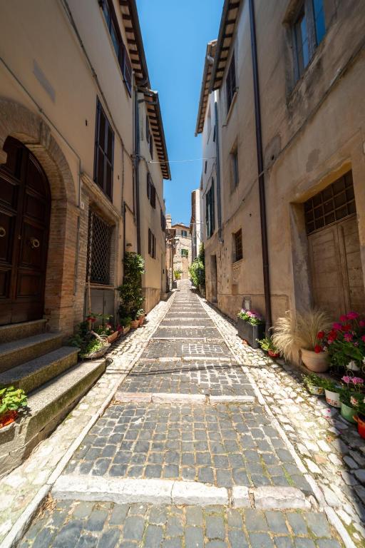 an empty cobblestone street in an old town at Malù Cozy Borgo Retreat in Casperia