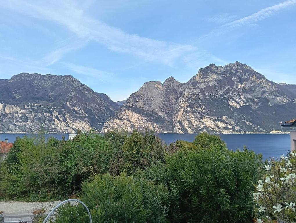 a view of a mountain range with a lake at Villa Ulrica in Nago-Torbole