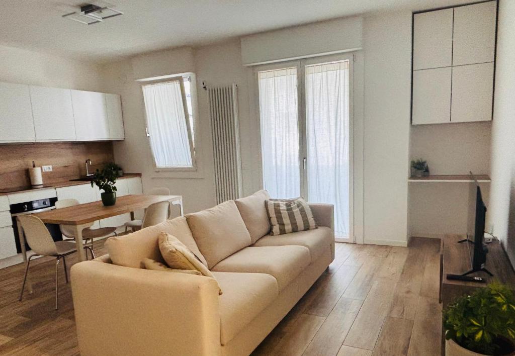 a living room with a couch and a table at Bassano Sweet Home in Bassano del Grappa