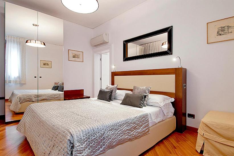 Ein Bett oder Betten in einem Zimmer der Unterkunft Salmaso Apartments
