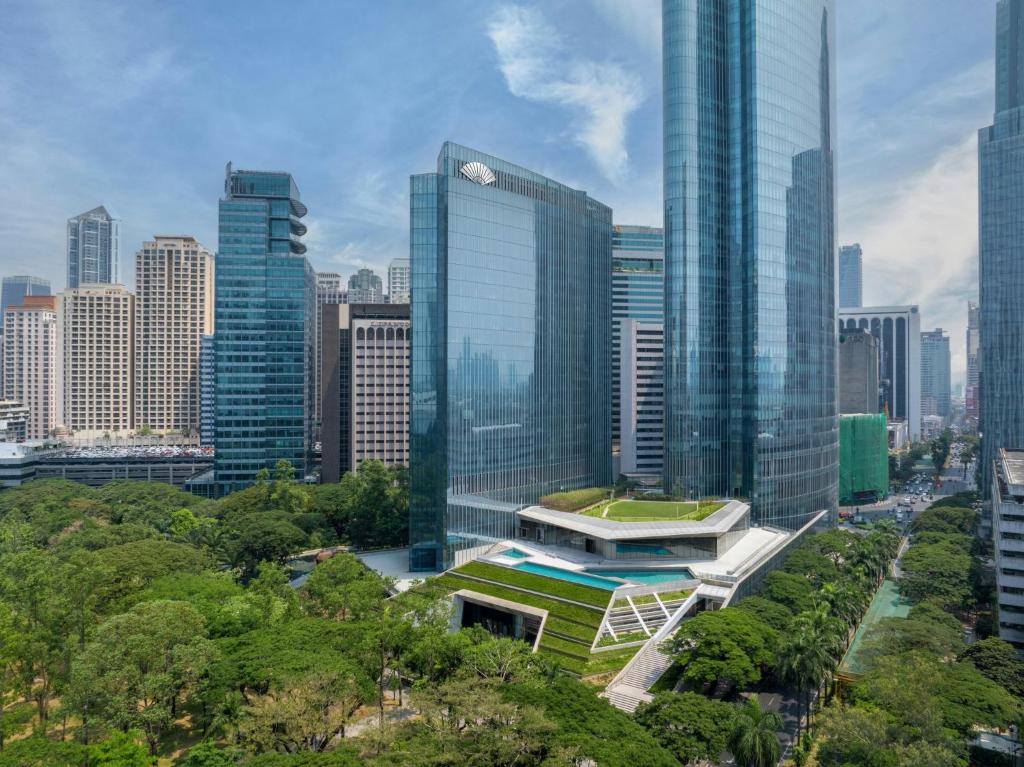a view of a city with tall buildings at Mandarin Oriental Makati, Manila in Manila