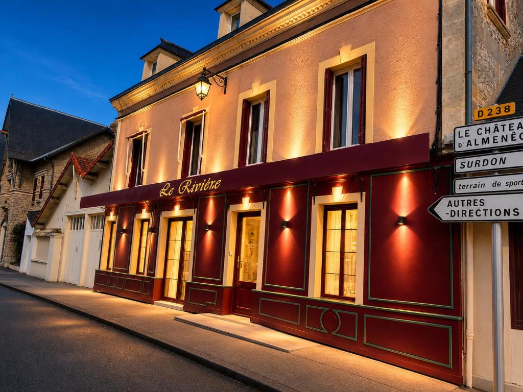 a building on the side of a street at Gîte Le Riviéra in Almenêches
