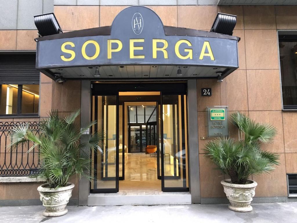 a building with a sign that reads saeco at Hotel Soperga in Milan