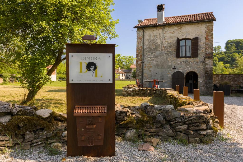a clock tower in front of a building at Dimora Dory Luxury in Nave