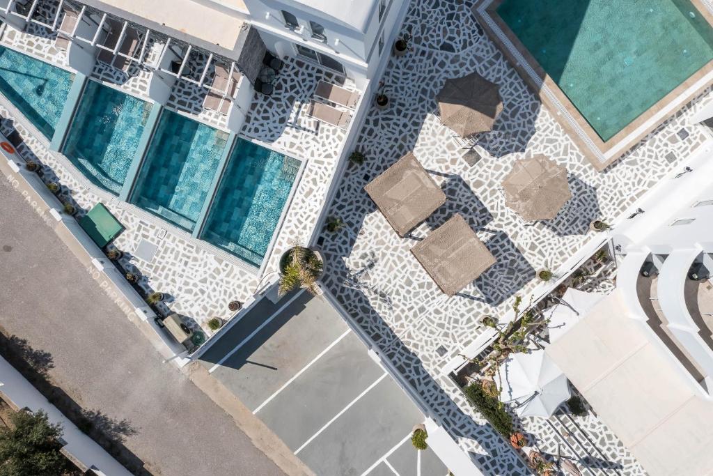 an overhead view of a building with a swimming pool at Alexander Studios & Suites - Adults Only in Faliraki