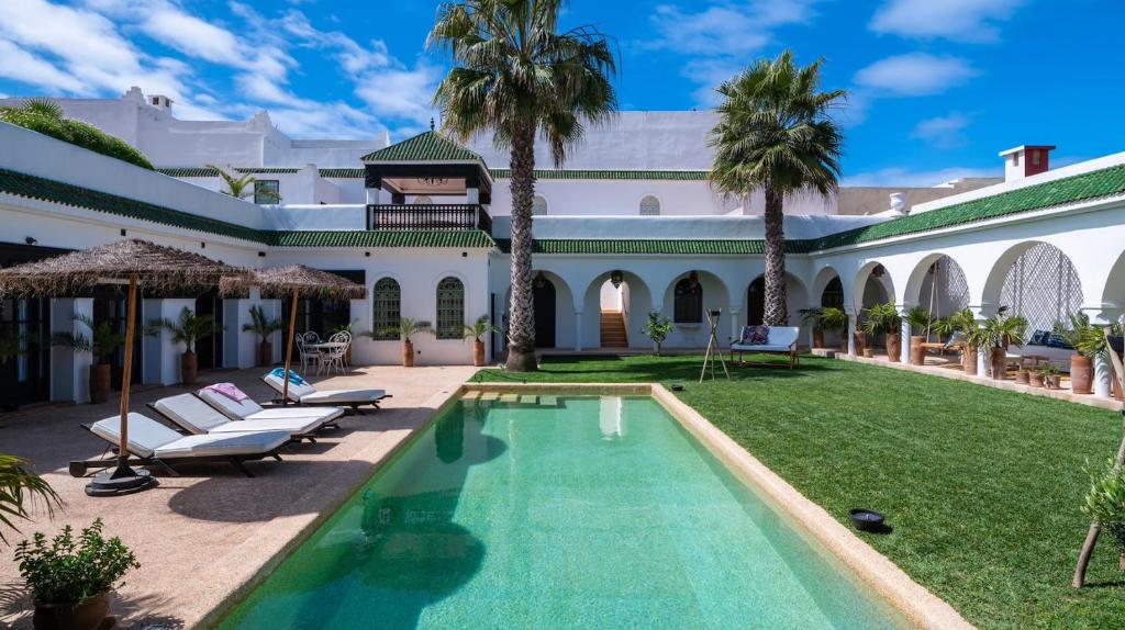 an exterior view of a villa with a swimming pool at Villa NoYa in Oualidia