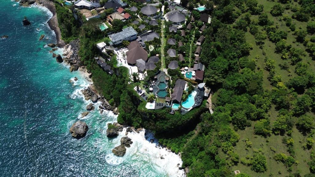 an aerial view of a resort on the shore of the ocean at Biu Biu Resort Bali in Jimbaran