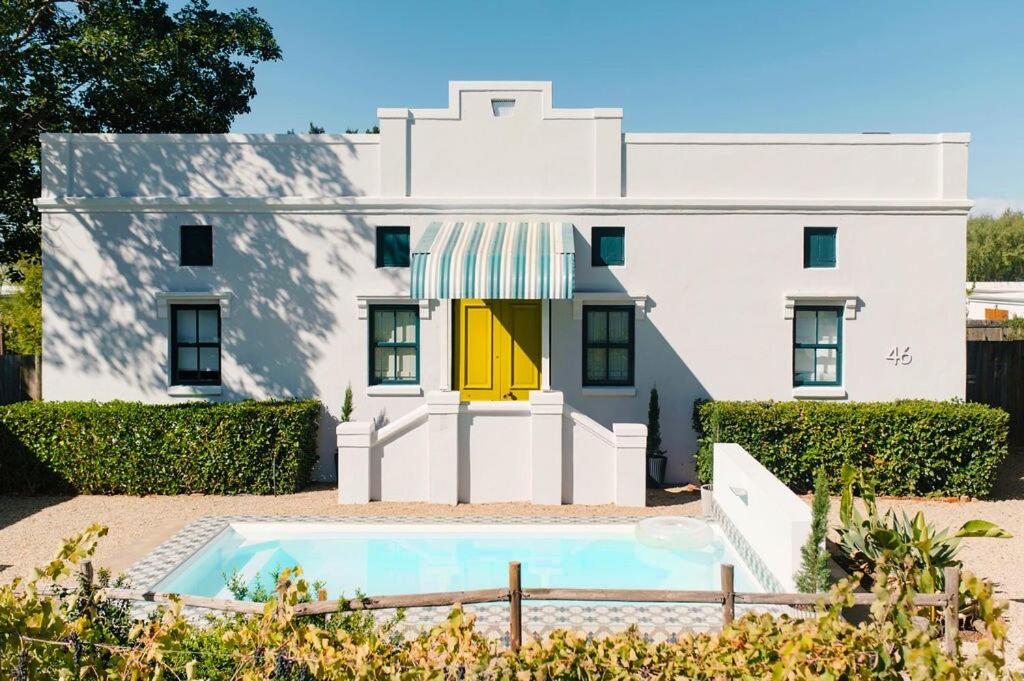 a house with a pool in front of it at Artful Hideaway with Pool & Fireplace in Riebeek-Kasteel