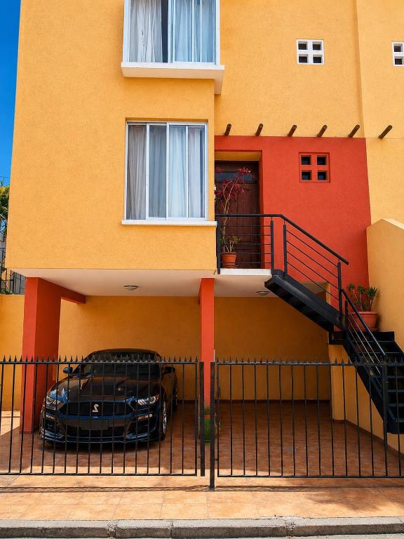 a black car parked in front of a building at EXPONOR 2026 Casa 3D 2B in Antofagasta