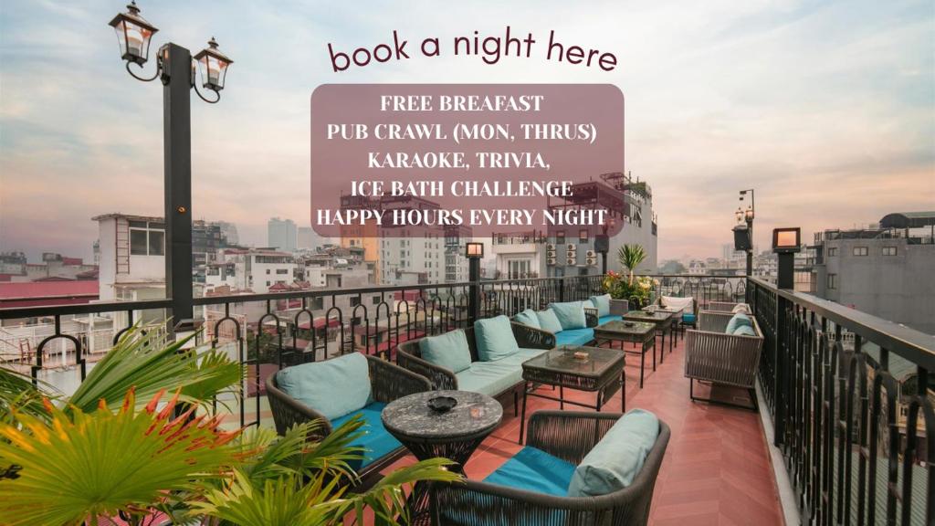 a balcony with chairs and tables on a building at Hanoi Loopers Hostel & Rooftop Bar in Hanoi