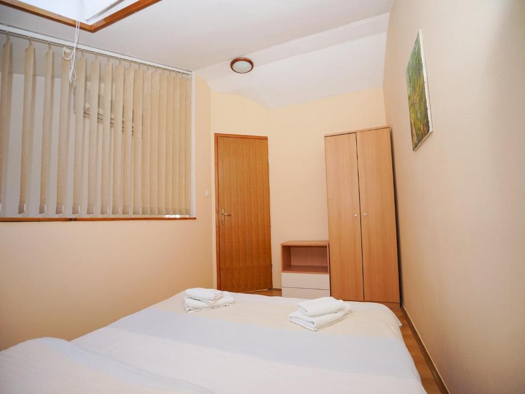 Łóżko lub łóżka w pokoju w obiekcie Apartment Krianca