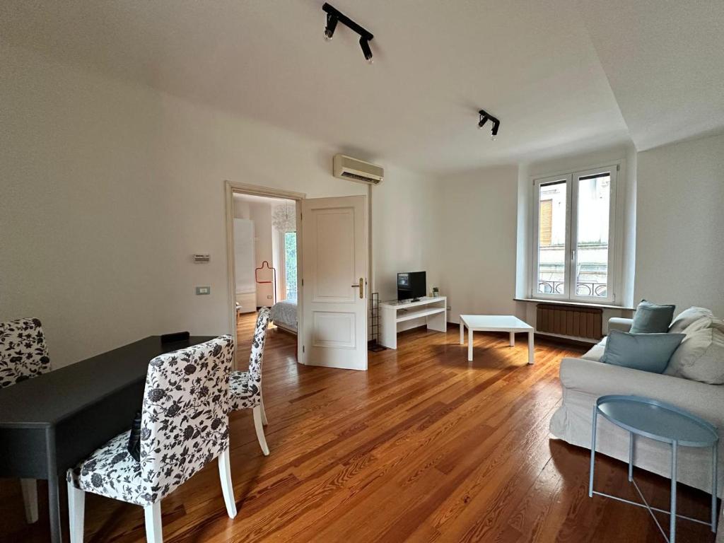 a living room with a couch and a table at L'Angolo di Mede in Mede