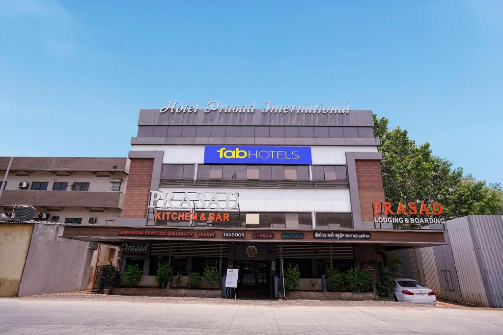 a building with a job toties sign on it at FabHotel Prasad International in Mumbai