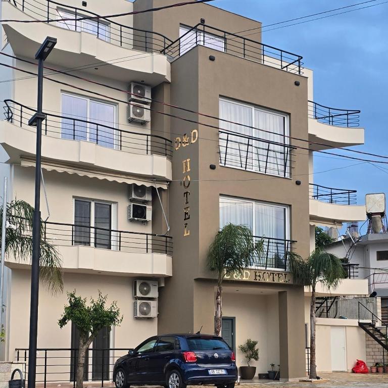 a car parked in front of a building at D&D HOTEL Ksamil in Ksamil
