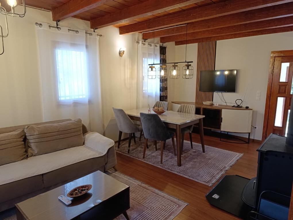 a living room with a couch and a table at Holiday house Ilidza Sarajevo in Crkvine