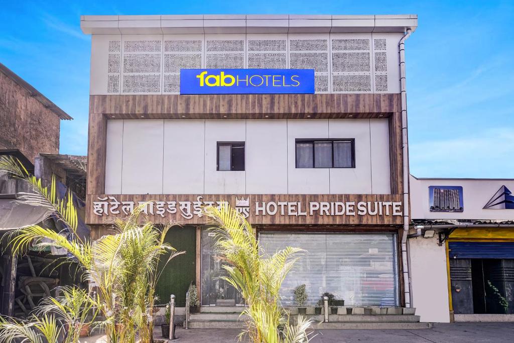 a building with a sign that reads job hotels at FabHotel Pride Suitz in Mumbai
