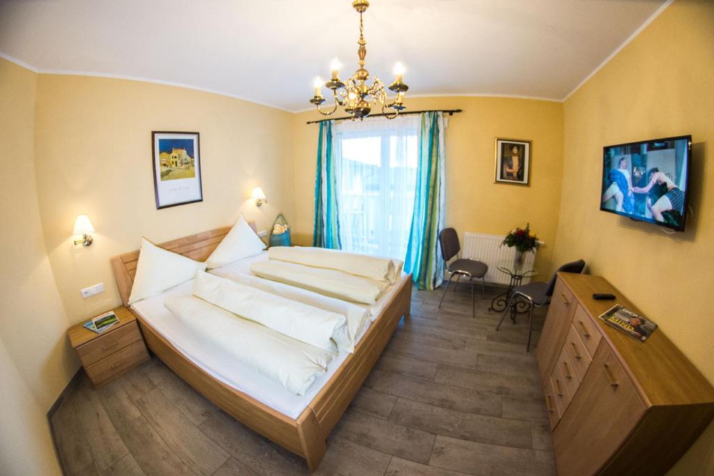 Postel nebo postele na pokoji v ubytování Seehotel Steiner
