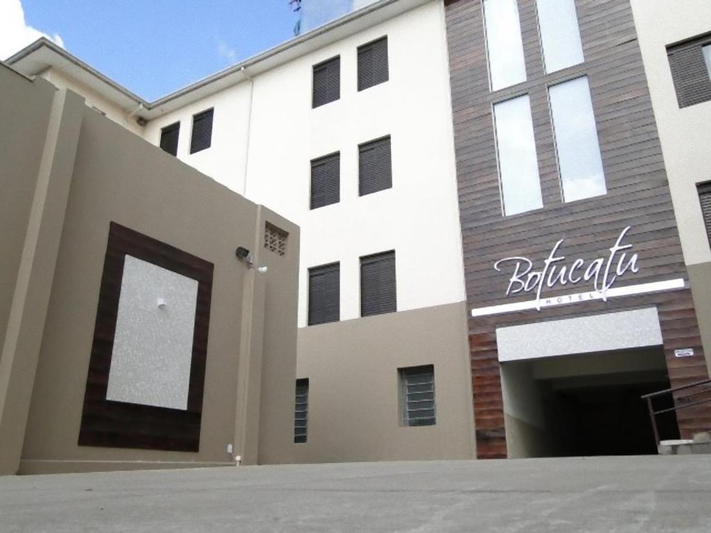 a building with a sign that reads bibliography at Botucatu Hotel in Botucatu